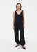Black loose-fit trousers with a relaxed silhouette, featuring a high waist and elasticated cuffs at the ankles.