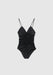 Black ruched one-piece swimsuit with a deep V-neckline and thin spaghetti straps, laid flat against a plain background.