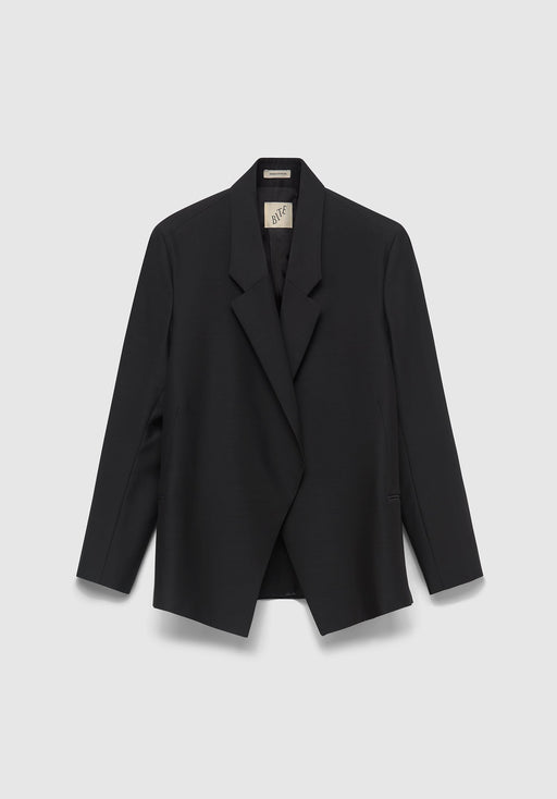 A black tailored blazer hanging against a light gray background, featuring a notched lapel, long sleeves, and a visible inner collar tag.